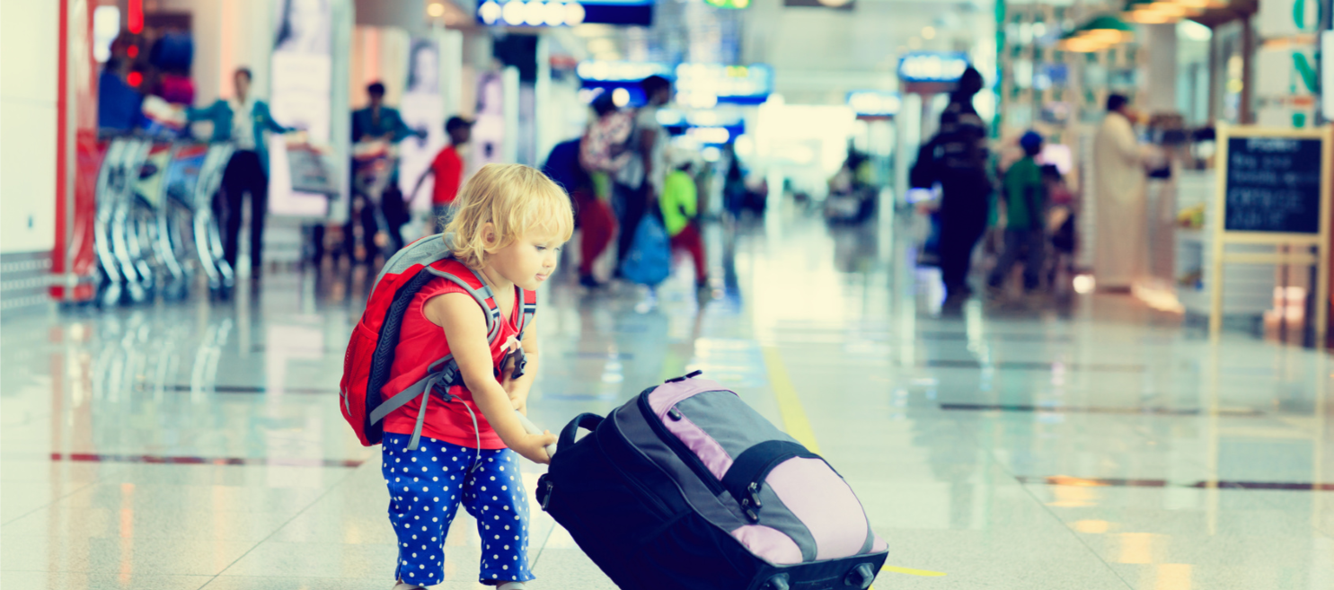 toddler-pulling-suitcase-in-airport