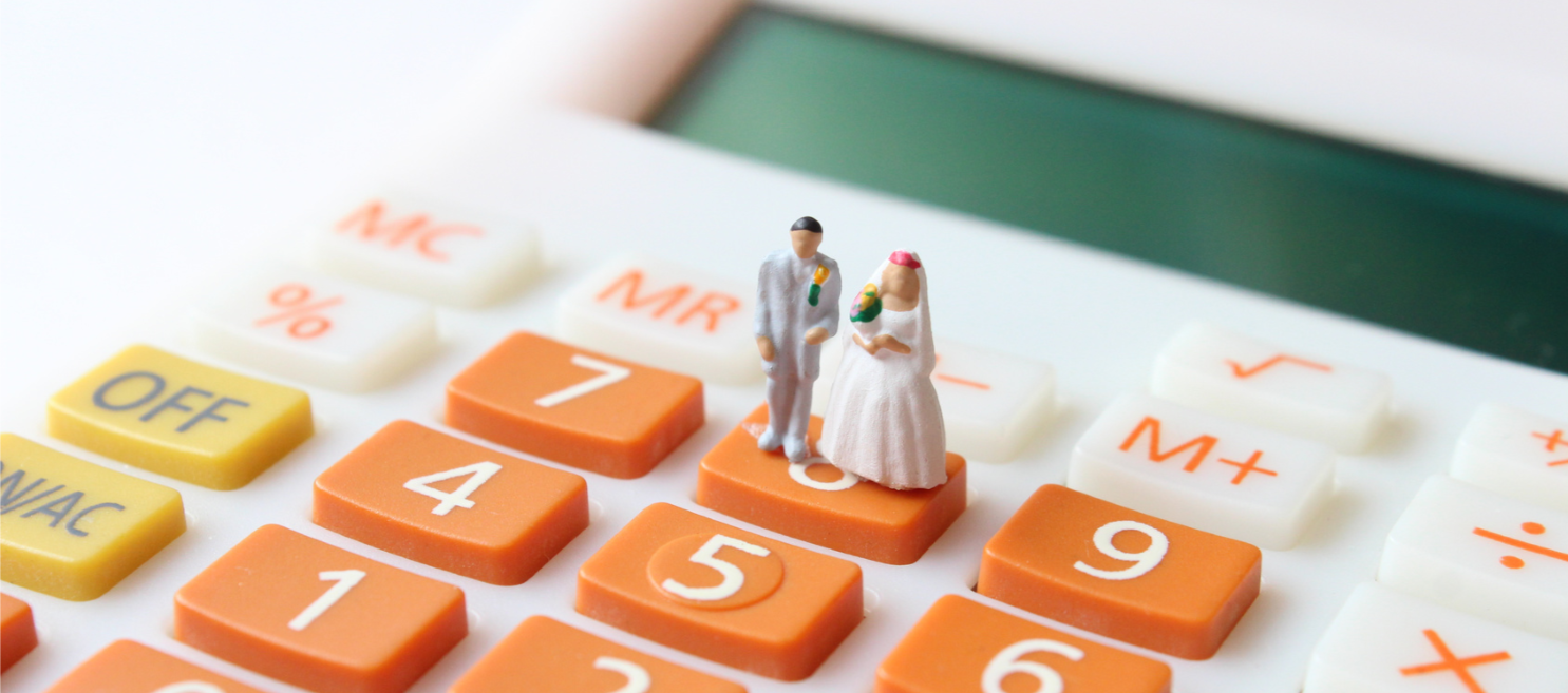 bride-groom-wedding-cake-topper-on-calculator